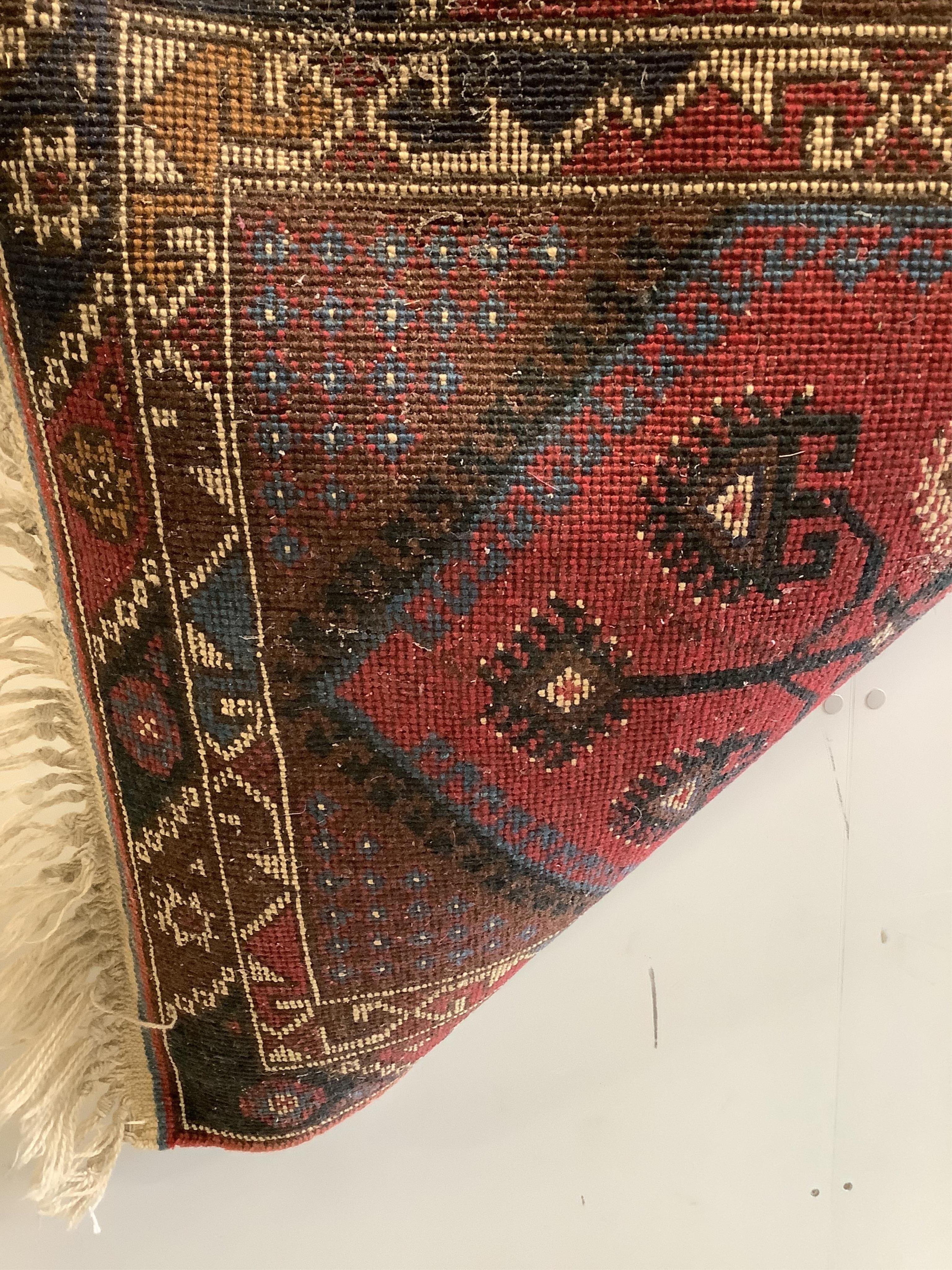 Three Caucasian style red ground runners, largest 290 x 72cm. Condition - fair